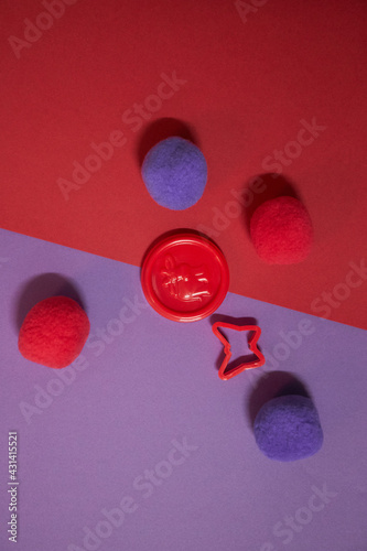 purple and red caps with play toys