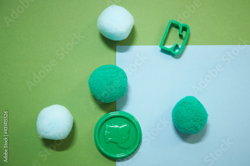 cyan and green caps with play toys