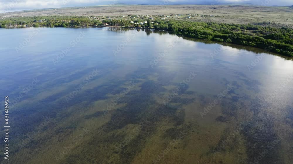 2020 - Excellent aerial shot of a lagoon by residential housing on the coast of Papohaku, Hawaii. 2020 - Excellent aerial shot of a lagoon by residential housing on the coast of Papohaku, Hawaii.
