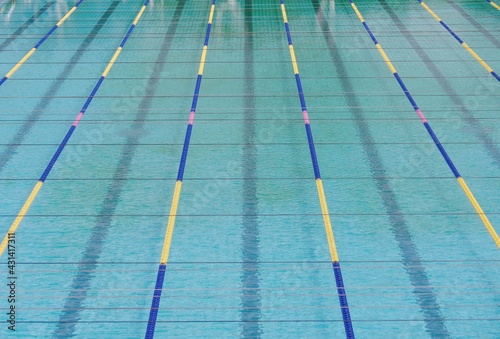 A empty swimming pool and swimming lanes.