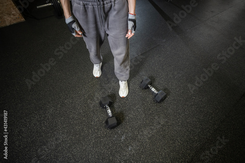 Wide angle dumbbells on the floor in the gym