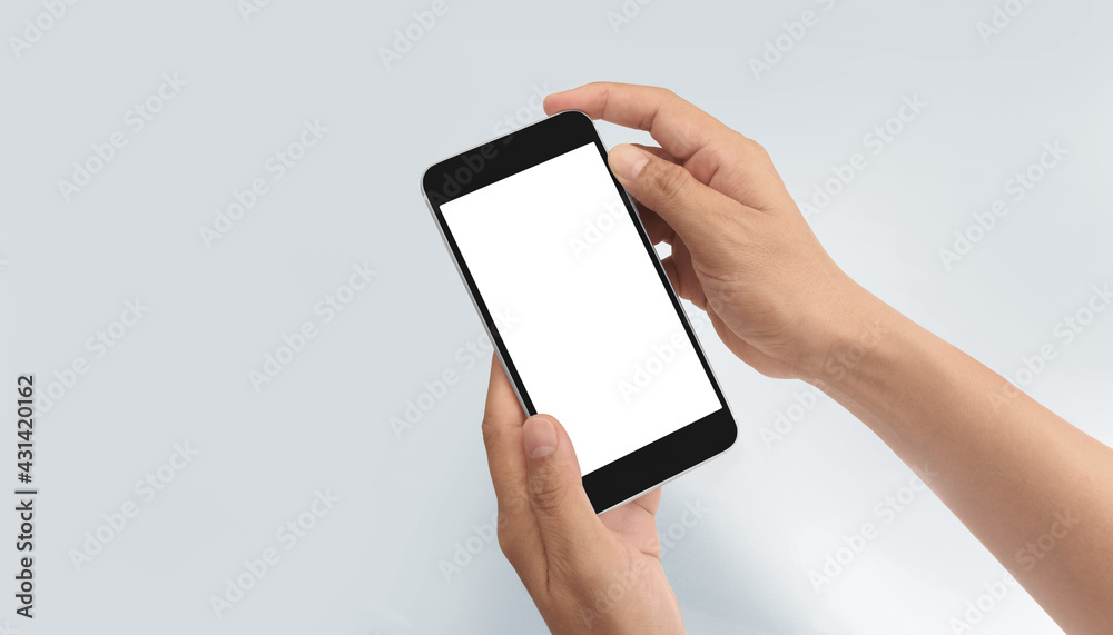 Hand holding smartphone device touching screen Hand holding smartphone device touching screen