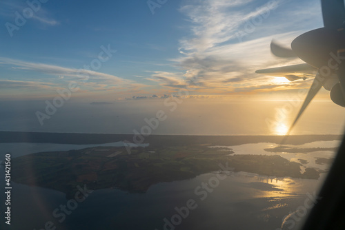 Bay of Plenty below through plane window while flying over Tauranga New Zealand.