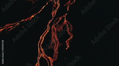 Aerial drone view over glowing, blood red lava veins, at the Geldingadalir Volcano photo