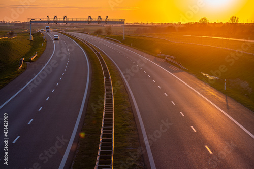 Empty highway at sunset