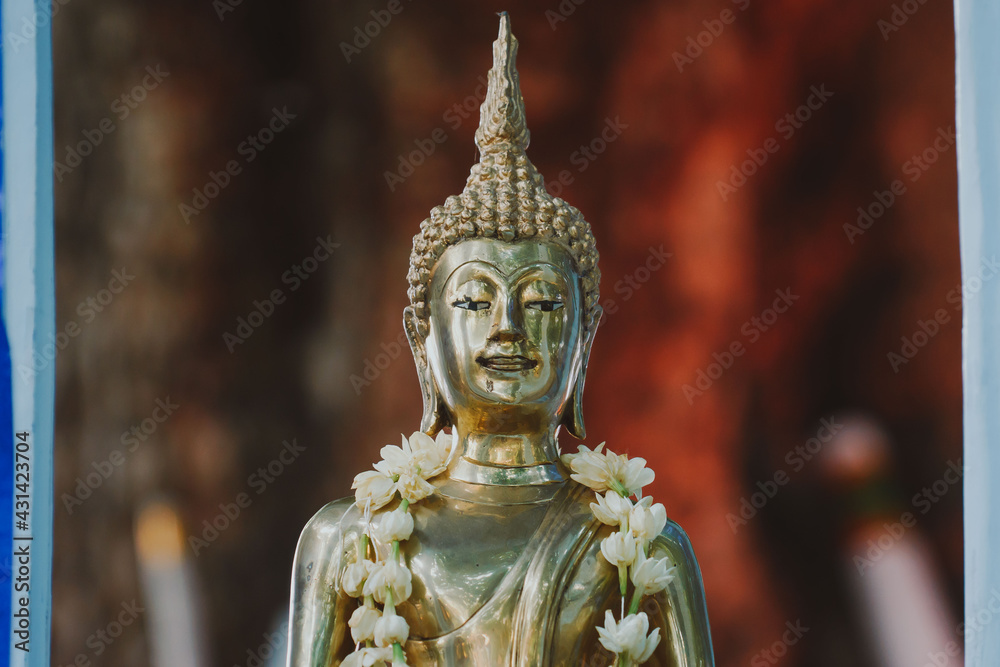 Thai people celebrate Songkran Festival by pouring water over
Buddha statue to signify cleansing for the new year Thai people celebrate Songkran Festival by pouring water over
Buddha statue to signify cleansing for the new year