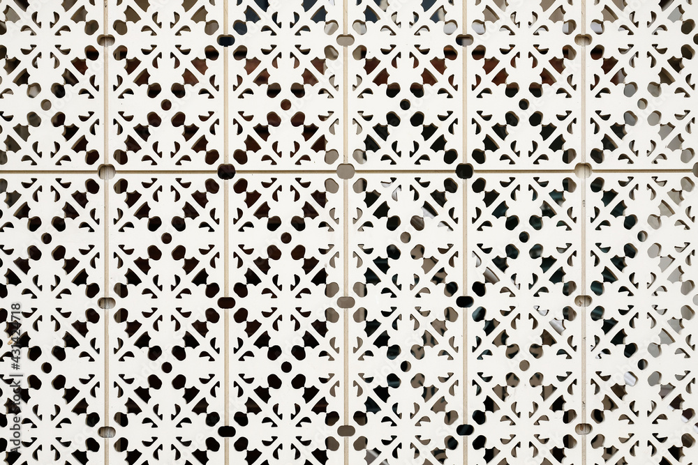 Wood carving with geometric pattern for home interior design elements, screens and room dividers.