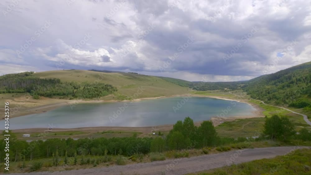 Pan from left to right of beautiful mountain and lake landscape Pan from left to right of beautiful mountain and lake landscape