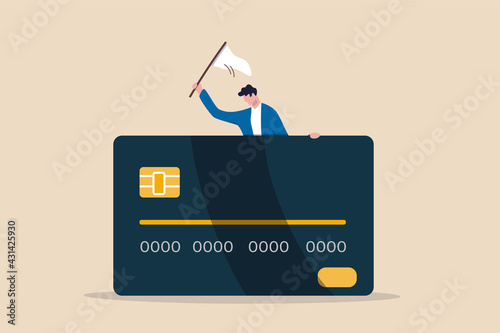 Credit card debt compromise, accept failure and negotiate with debtor concept, struggle bankruptcy man surrender carry and waving the white flag behind big credit card debt. photo