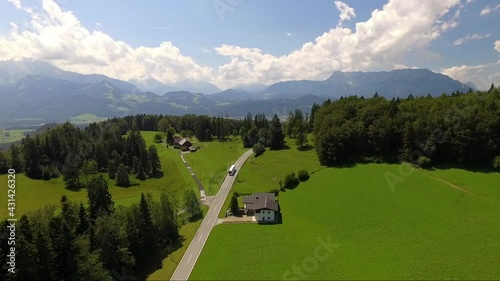 Aerial View on Coach Bus at Krispl Adnet Gaissau with Untersberg near Salzburg Austria by Drone photo