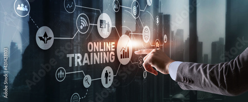 Online Training concept. Business Hand pressing OT inscription