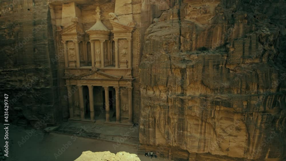 Petra, Jordan. The Treasury. Ancient Petra in Jordan, Amazing high angle, top view, side dolly left, Timelapse, Hyperlapse for Al Khazneh. The Treasury at ancient Petra in Jordan. 4K footage