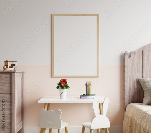 Photo frame mockup on a wall in a child's bedroom with a table and chairs on the floor.3d redering. © redrabbit007