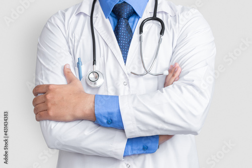 Young male doctor arm cross over isolated background, health concept