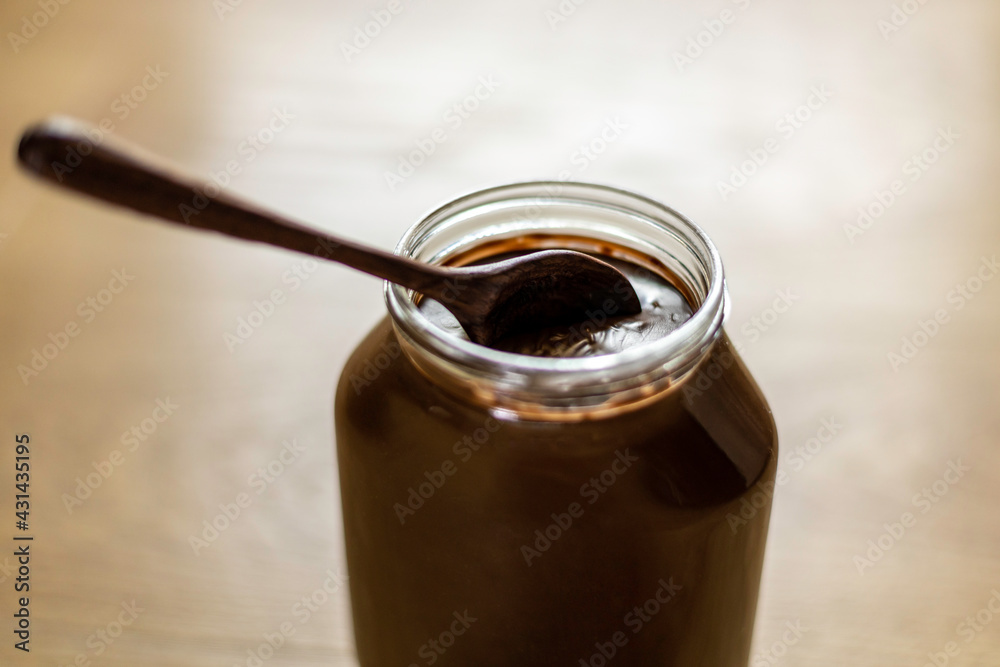 jar with chocolate cream isolated and spoon jar with chocolate cream isolated and spoon