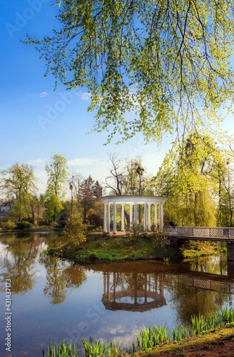 romantic white pavilion in a park 