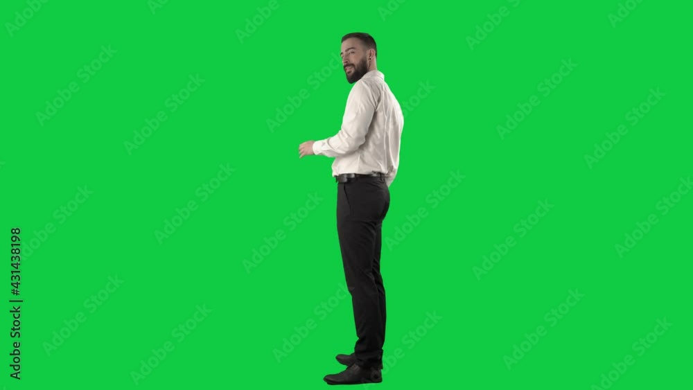 Side view of business man showing direction and beckoning at camera. Full length on green screen chroma key background. Side view of business man showing direction and beckoning at camera. Full length on green screen chroma key background.
