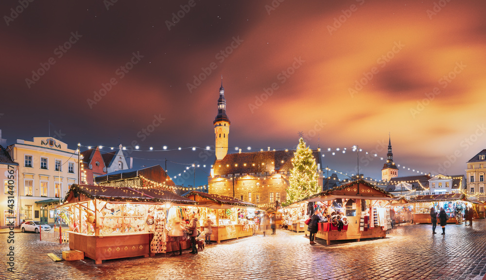 Tallinn, Estonia. Traditional Christmas Market On Town Hall Square. Trading Houses With Sale Of Christmas Gifts. Night Sky Above Famous Landmark. Altered Night Sky. Panorama, Panoramic View