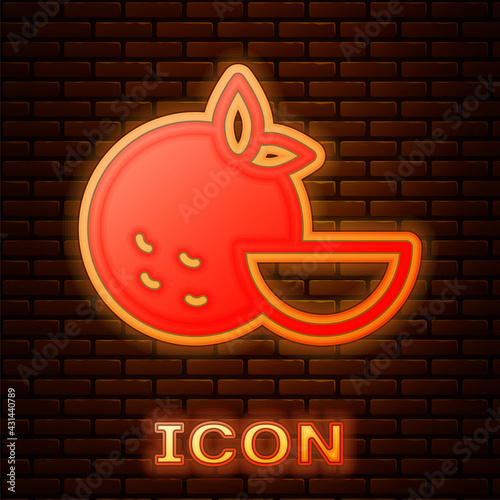 Glowing neon Orange fruit icon isolated on brick wall background. Vector