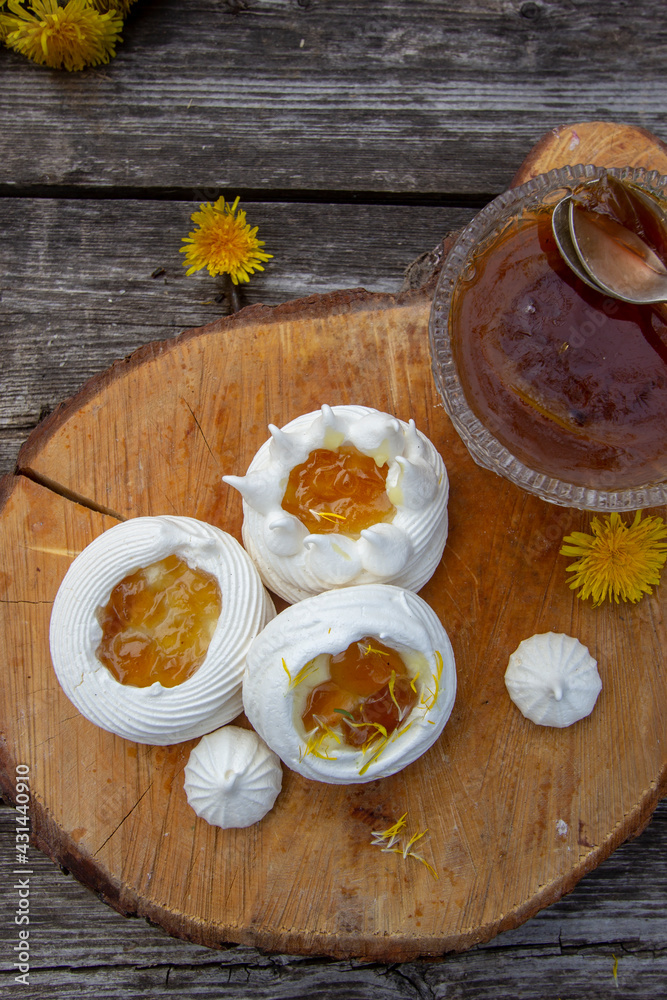Fototapeta premium Anna Pavlova cake with lemon curd and dandelion syrup