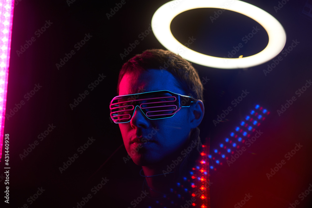 Cyberpunk style portrait of man in futuristic costume. Cyberpunk style portrait of man in futuristic costume.