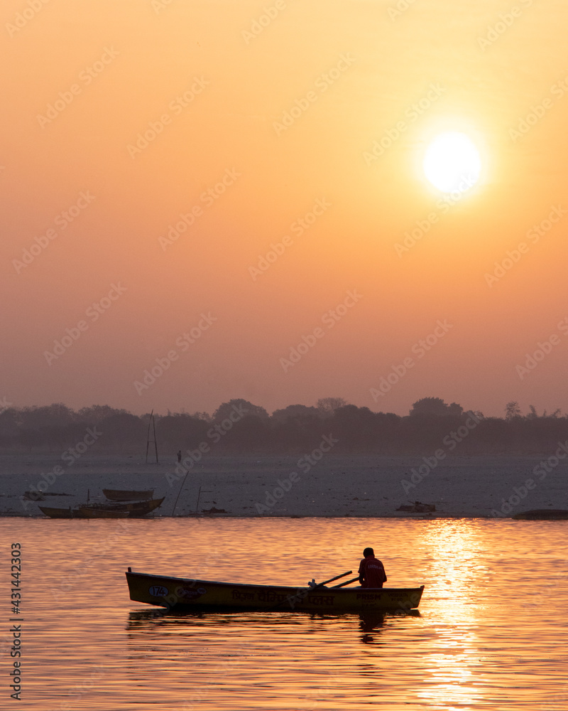boating on River Ganga when sun rise at Varanasi Stock Photo