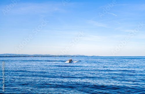 alonely high-speed boat  on the beach © PHAT