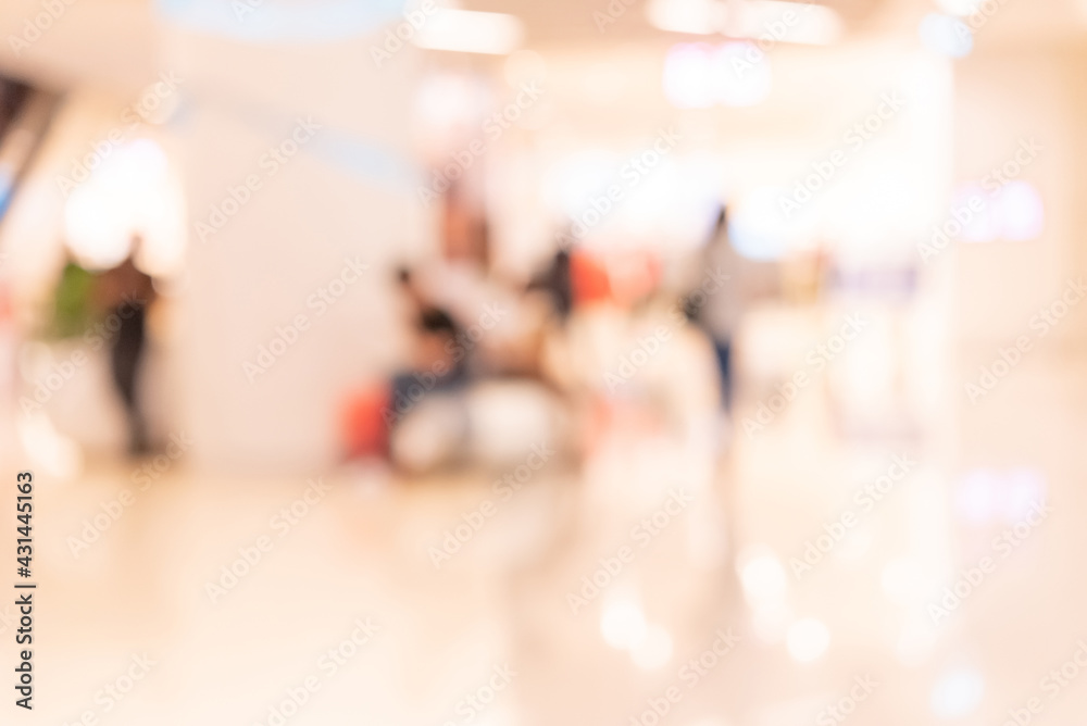 Abstract defocused or blurred background of the shopping mall with nice department store interior. which including of people and shop store.	