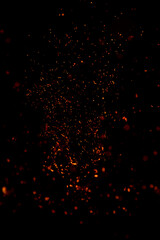 small sparks of fire on a black background