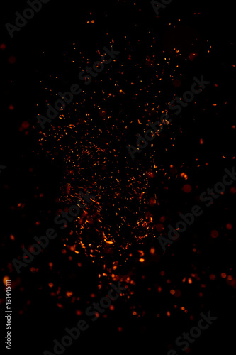 small sparks of fire on a black background