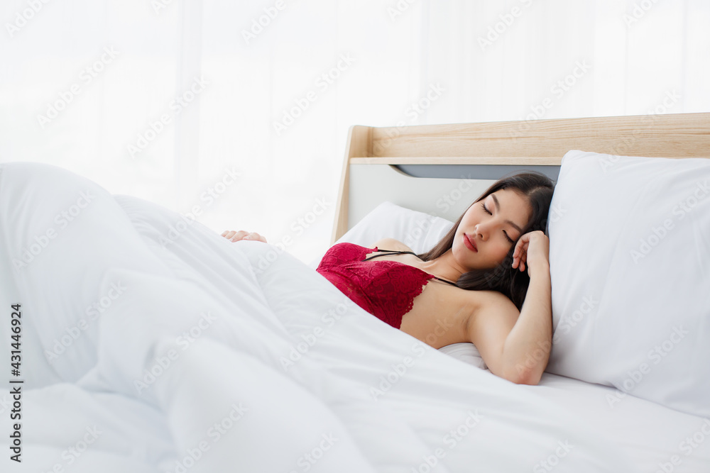 Beeg Sleeping Video - Beautiful young naughty sexy girl with red pajamas still in deep sleep on  white bed with blanket in bright morning of her relax day Stock Photo |  Adobe Stock
