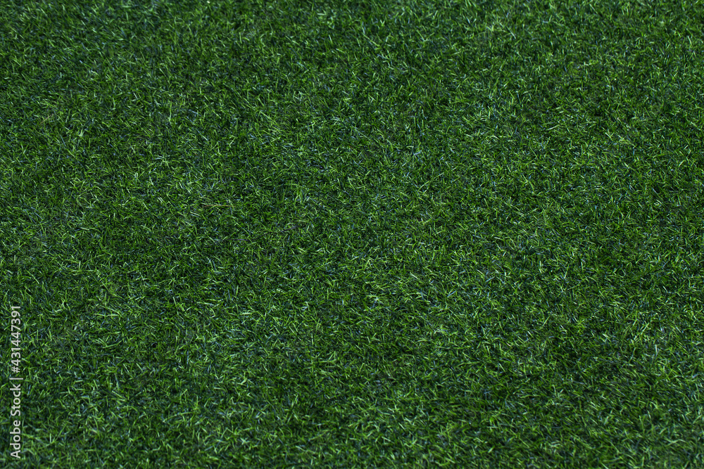 Obraz premium Green grass texture for golf course, soccer field or sports background. Concept design of Artificial green grass for design with copy space for add text or image.