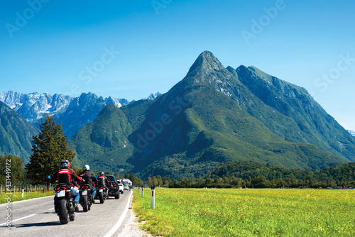 Motorcyclist column moving on alpine highway