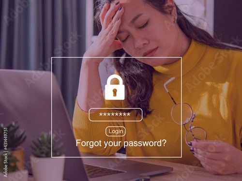 Foto Abstract background design an Overworked Asian businesswoman suffering from headache and thinking sitting tired in front of laptop because Forgot password to get access into her personal laptop