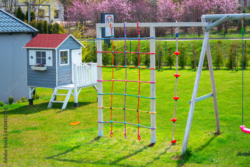 Garden playground for children with a climbing net