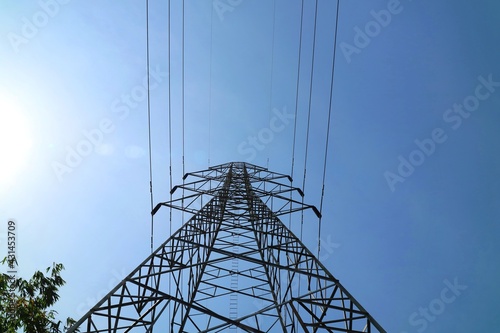 High voltage pole, Electricity post with clear blue sky. Industrial, technology and nature concept.