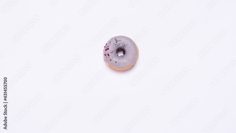 Tempting donuts dessert with iceing and sprinkles. Sweet sugar round doughnuts of different flavours. Top horizontal view copyspace. Healthy diet and junk food concept Tempting donuts dessert with iceing and sprinkles. Sweet sugar round doughnuts of different flavours. Top horizontal view copyspace. Healthy diet and junk food concept
