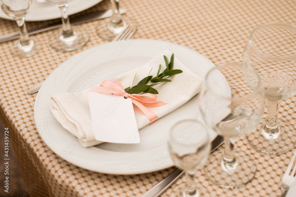 Card with eucalyptus branch on a banquet table. Wedding day. Card with eucalyptus branch on a banquet table. Wedding day.
