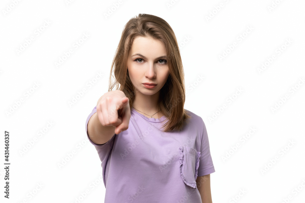 close up displeased young woman pointing finger at camera, blaming you, isolated on white background close up displeased young woman pointing finger at camera, blaming you, isolated on white background