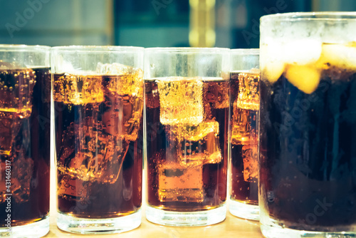 Refreshing Bubbly Soda Pop with Ice Cubes. Cold soda iced drink in a glasses - Selective focus, shallow DOF photo