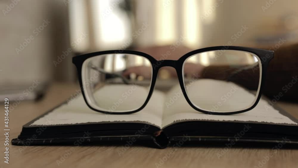 Through glasses view of crop freelancer typing on laptop while working on project remotely Through glasses view of crop freelancer typing on laptop while working on project remotely