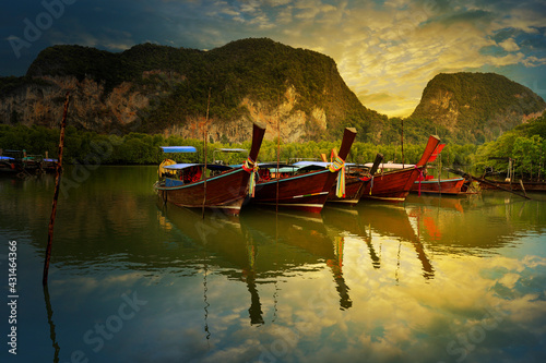  view of limestone island and long tail boat in phang nga bay in thailand