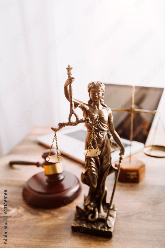 Business and lawyers discussing contract papers with brass scale on desk in office. Law, legal services, advice, justice and law concept picture with film grain effect Business and lawyers discussing contract papers with brass scale on desk in office. Law, legal services, advice, justice and law concept picture with film grain effect