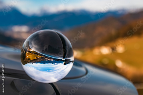 Crystal ball alpine landscape shot on a sunny winter day near Berchtesgaden, Bavaria, Germany © Martin Erdniss