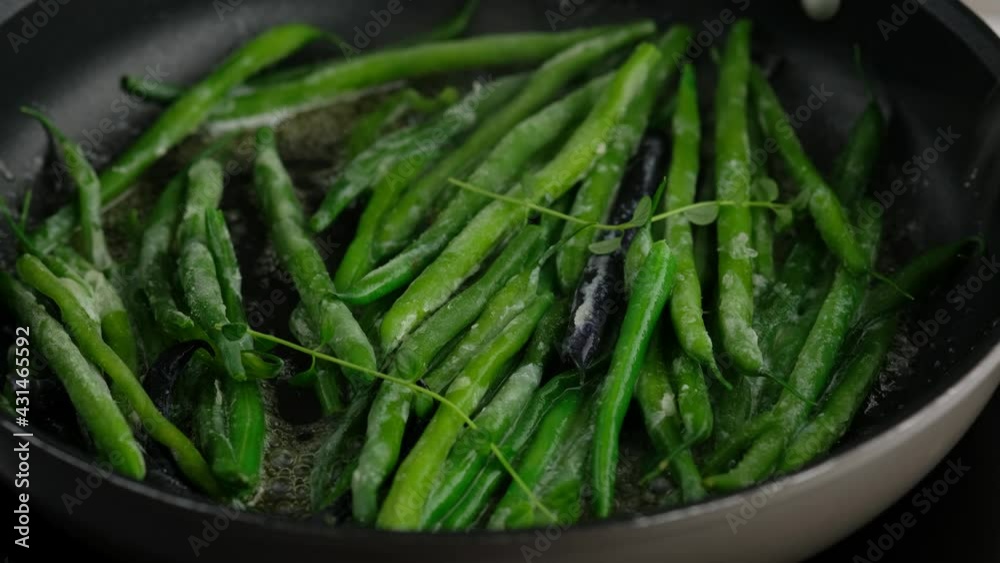 Green beans with spices ready for cooking in frying pan. Bio green beans. Cooking healthy home-made food. Green beans with spices ready for cooking in frying pan. Bio green beans. Cooking healthy home-made food.