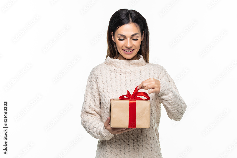 Beautiful woman in christmas hat with christmas gift Beautiful woman in christmas hat with christmas gift