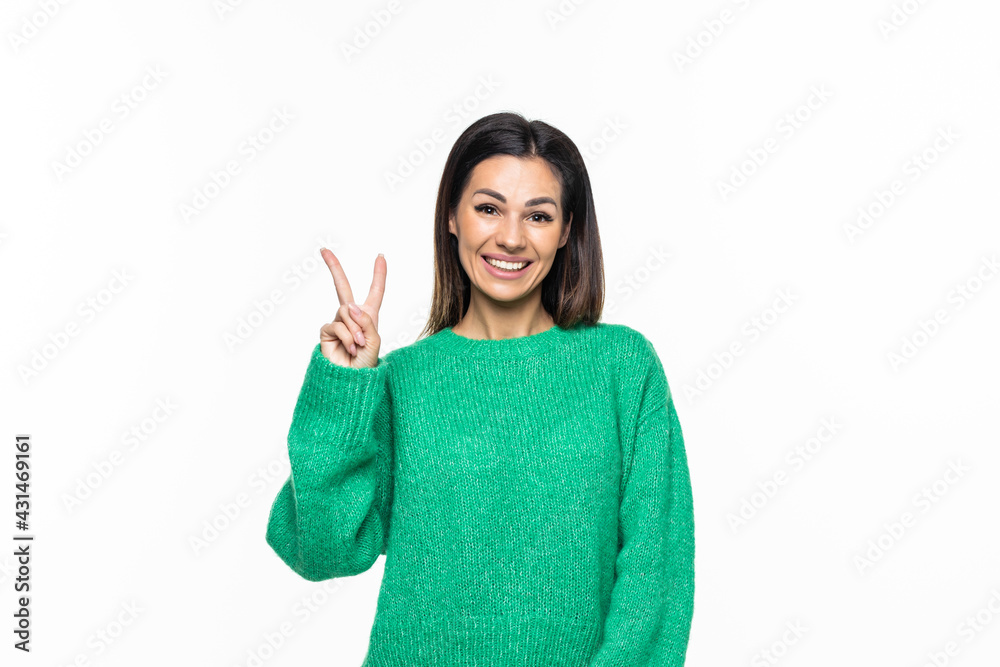 Beautiful young woman showing peace victory sign isolated on white background Beautiful young woman showing peace victory sign isolated on white background