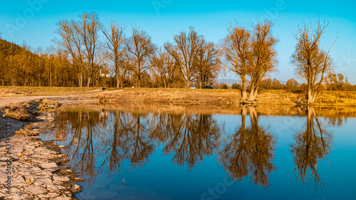 Beautiful sunny winter view with reflections near the famous Bogenberg, Danube, Bavaria, Germany photo