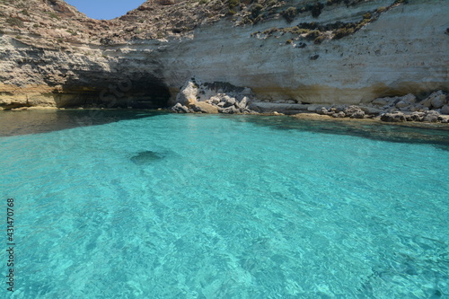 Fototapeta Naklejka Na Ścianę i Meble -  Transparent and blue water in the sea of Lampedusa at the Rabbits beach. The Pelagie Islands are the southernmost point of Italy in Sicily.