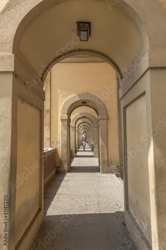 Florence Italian Symmetrical Endless Arch Walkway in Tunnel or a Passage with a Series Arches